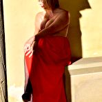 Second pic of Older blonde Barby Slut doffs a red evening gown to pose nude in hosiery