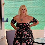 First pic of Mature blonde Melody looses her large breasts and fat ass from a dress