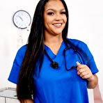 First pic of Afro-Latina nurse Dorian Del Isla takes a cumshot on her big tits after a fuck