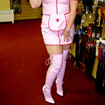 First pic of Blonde amateur Samantha works free of a latex nurse outfit in a sex shoppe