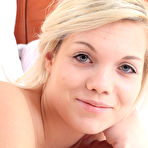 Second pic of Blonde girl Iza Subel lays back on her bed while naked in stockings