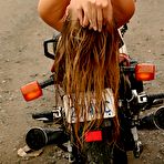 Fourth pic of British amateur Hayley Marie Coppin unzips from a latex outfit on a motorcycle