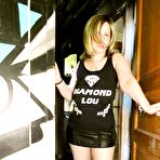 First pic of Older amateur Posh Sophia shows her large tits in a graffiti strewn building