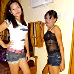 First pic of Asian girls Irish and Leann get completely naked atop a bed