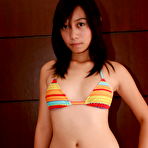 First pic of Asian first timer bares her nice teen tits as she gets naked on a bed