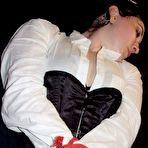 Third pic of Amateur model Little Devotchka is gagged with duct tape while bound with rope