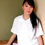 First pic of Asian teen Carla touches her breasts and pussy in over the knee socks