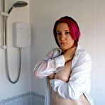 Second pic of Older tattooed redhead Sara Banks gets totally naked while taking a shower