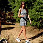First pic of Brunette teen Lili Charmelle gets completely naked on an ottoman in a backyard