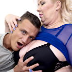 Third pic of Mature BBW kissing her young lover and having her big tits sucked and licked