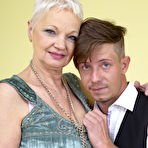 First pic of Short haired cougar has her large boobs licked by her young lover boy