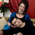 Third pic of Mature lady gives her boy toy a kiss to get foreplay started