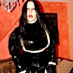 Third pic of Solo model Lady Angelina smokes while exposing herself in a rubber uniform