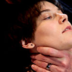 First pic of Brunette dyke is flogged by a man while restrained in a dungeon