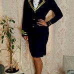 First pic of Flight attendant hitches up her skirt while struggling against handcuffs