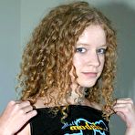 Second pic of Amateur model with curly hair unleashes her great tits in thong underwear