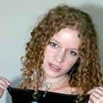 Third pic of Amateur model with curly hair unleashes her great tits in thong underwear