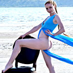 Second pic of Flexible teen Stacy Redi gets completely naked on a chair at the beach