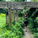 Fourth pic of Asian chick Flawless Meow wears a neck collar with her arms bound in a park