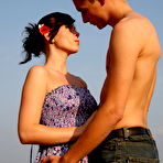 First pic of Horny young couple has sex on a mound of loose straw in a field