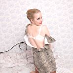 Second pic of Classy lady Lucy Lume licks a dildo after disrobing to girdle panties & nylons