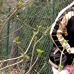 First pic of Blonde chick with a pierced pussy pulls down her pants to pee on fallen leaves