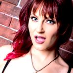 Second pic of Sexy redhead Phoenix Askani takes off her clothes afore a brick wall