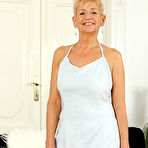 First pic of Horny older granny Scarlett J gets naked to fondle saggy tits & spread legs