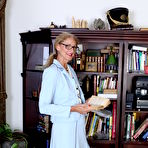 First pic of Classy mature granny strips off her suit to toy her pussy in the library