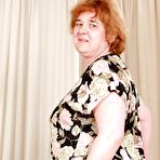 First pic of Redhead granny with massive flabby tits exposing her hairy cunt