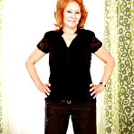 First pic of Filthy redhead granny with shaved cunt stripping and spreading her legs