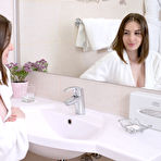 First pic of Nice teen Lillie Pie removes a white bathrobe before bathing in the buff