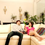 First pic of Young brunette receives a money shot after having sex on a sofa