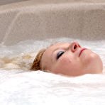 Fourth pic of Overweight blonde Sindy Bust looses her huge boobs in an outdoor hot tub