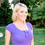 First pic of Natural blonde Krissy Lynn models clothed in yard wearing shorts