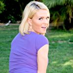 Fourth pic of Natural blonde Krissy Lynn models clothed in yard wearing shorts