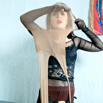Second pic of Fair skinned girl covers herself and strapon cock in layers of pantyhose
