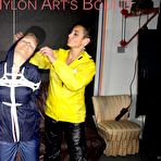 First pic of Shinynylonartsbound | Sandra tied and gagged overhead with ropes and a ballgag overhead prepared to be hunged up by Stella both wearing sexy shiny nylon rainwear (Pics) PART1of 2